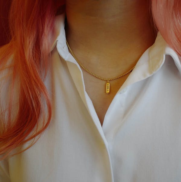 Chill Pill Necklace in Gold in model