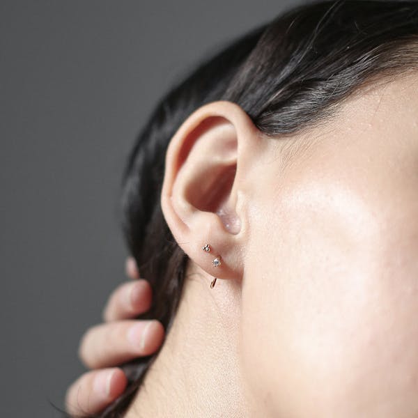 Crystal Huggie Earrings on model