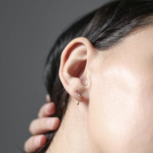 Crystal Huggie Earrings in Sterling Silver on model
