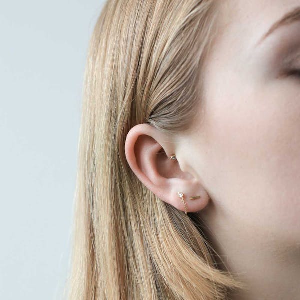 Little Bar Nap Earrings in Gold on model