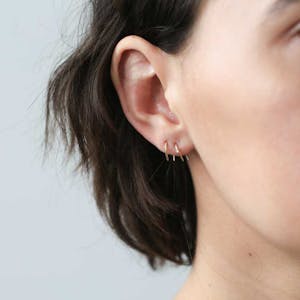 Large Whispering Star Open Hoop Earrings in Sterling Silver on model