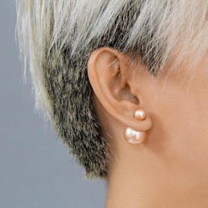 Isabelle Pearl Earrings in Champagne Pink on model