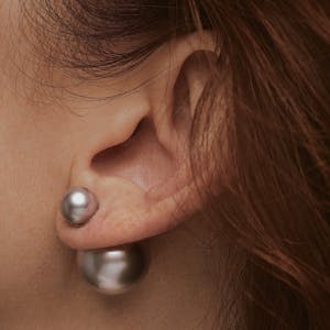 Equilibrium Reversible Pearl Earrings in Silver Lavender on model