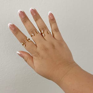 Floating Dewdrop Stacking Ring Trio on model