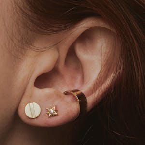 Gold Screw Earrings on model