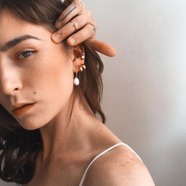 Luna Hoop Earrings in Gold Vermeil on model