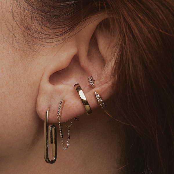 Mini Falling Star Chain Earrings in 14k Gold on model